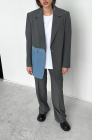 Oversized jacket with blue denim pocket, light grey